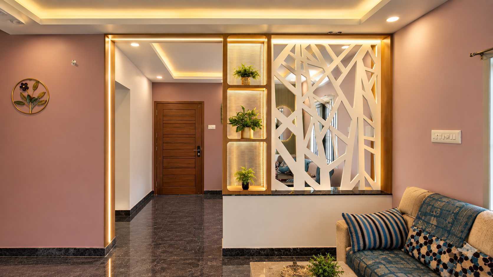 Modern living room partition with TV unit in Amal Raj’s Kanniyakumari home, designed by Decor Interior. Home Interior Design in Kanniyakumari